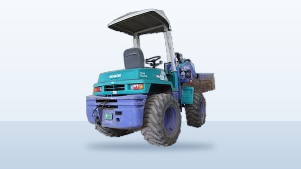 青緑の車体に屋根の付いた、小型の作業車。
